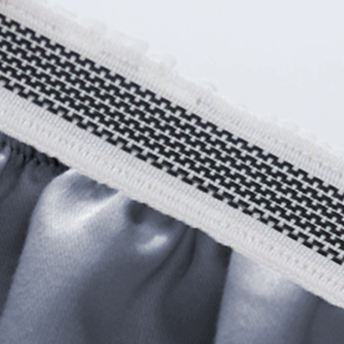 Close-up of the thick, patterned elastic band on the 1000 thread count deep pocket fitted sheet.