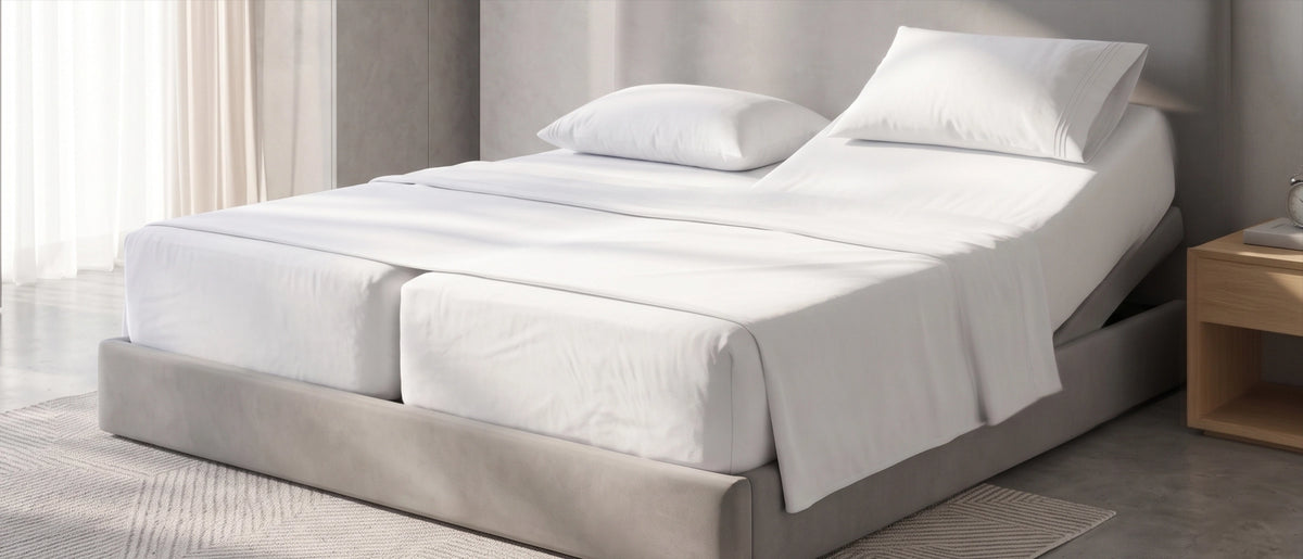 Beautifully made bed with a smooth fitted sheet in morning light
